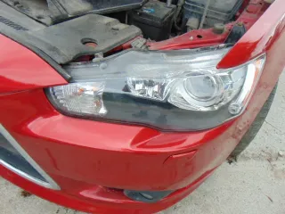  Фара левая Mitsubishi Lancer 8 Арт e12685094
