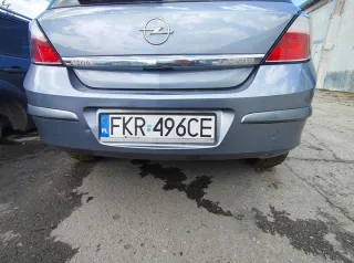 OPELASTRAH04 ZDERAKTYLNYHBZ163 Бампер задний Opel Astra H Арт e12766885, вид 1